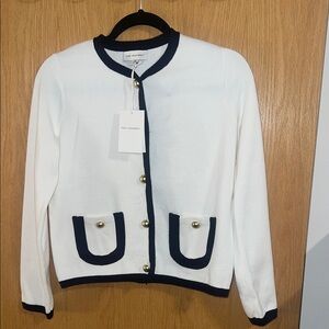 Elegant White Cardigan with Black Trim by See Sawney